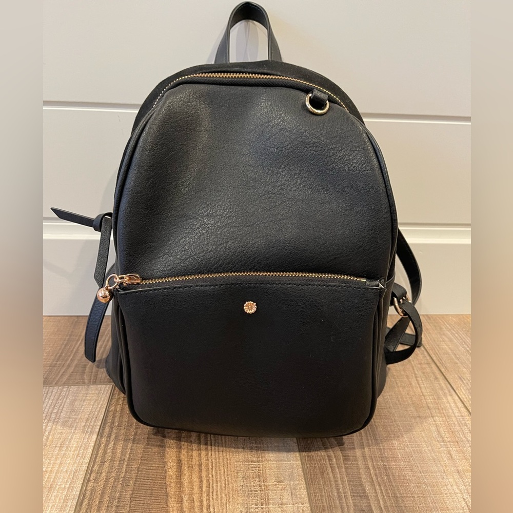 Black backpack purse with rose gold embellishments